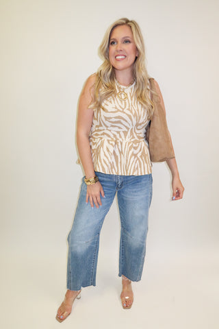 Untamed Feel Zebra Sleeveless Peplum Top - The Pink Tulip Clothing