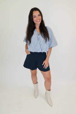 Worth Noting Plaid Tie Neck Top