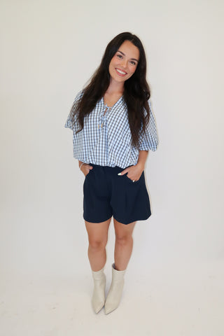 Worth Noting Plaid Tie Neck Top