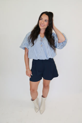 Worth Noting Plaid Tie Neck Top
