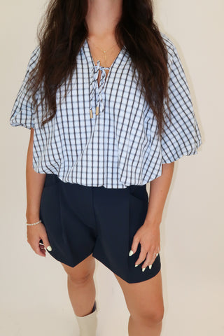 Worth Noting Plaid Tie Neck Top