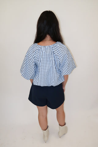 Worth Noting Plaid Tie Neck Top
