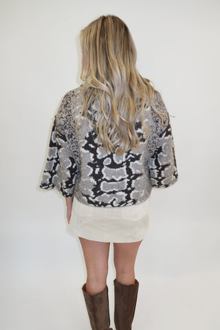 Snake Eyes Mock Neck Sweater
